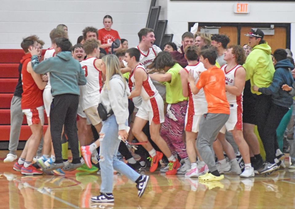 The Coldwater Cardinals celebrate their big OT win over Marshall Friday night