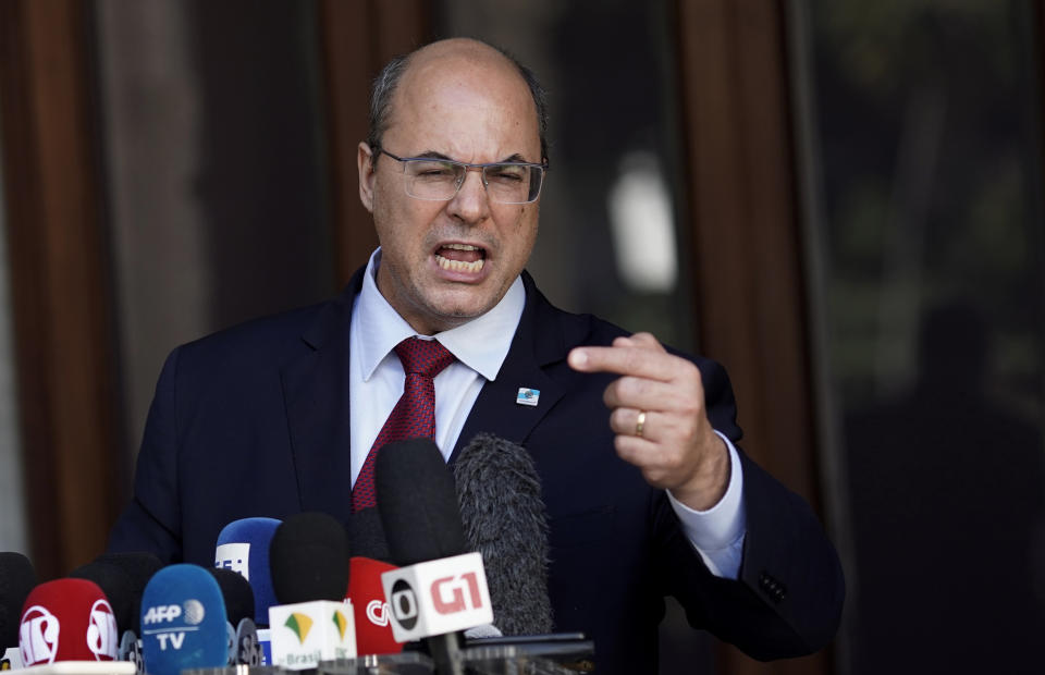 Wilson Witzel gives a press conference after a court temporarily removed the former federal judge from his office of Rio de Janeiro Governor due to corruption charges, at the Palacio de Laranjeiras governors residence in Rio de Janeiro, Brazil, Friday, Aug. 28, 2020. Investigators accuse Witzel of participating in a scheme involving fraud in public contracts to benefit companies linked to him and others under investigation. (AP Photo/Silvia Izquierdo)