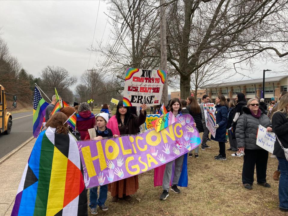 Student members of Holicong's Gay Straight Alliance club stand outside their Central Bucks school in Buckingham  as part of a protest against a recent policy teachers say would make LGBTQ support "invisible" by removing pride flags.