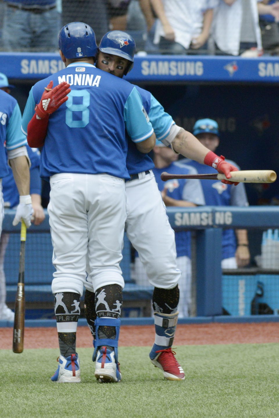 Toronto Blue Jays Kendrys Morales (8) celebrates with teammate Kevin Pillar after hitting a two-run home run against the Philadelphia Phillies during the third inning of a baseball game, Sunday, Aug. 26, 2018 in Toronto. (Jon Blacker/The Canadian Press via AP)