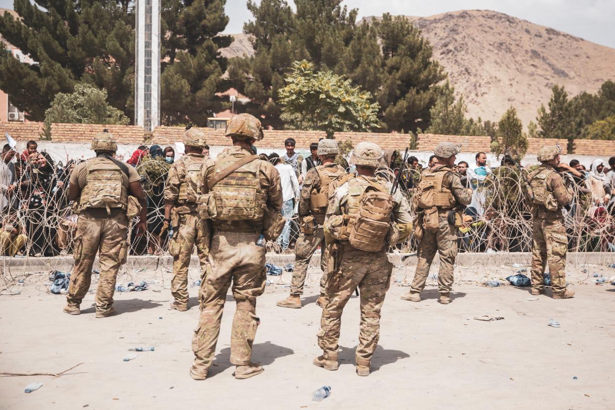 U.S. Soldiers and Marines assist with security at an Evacuation Control Checkpoint during an evacuation at Hamid Karzai International Airport, August  19, 2021 in Kabul, Afghanistan.  (U.S. Central Command Public Affa)