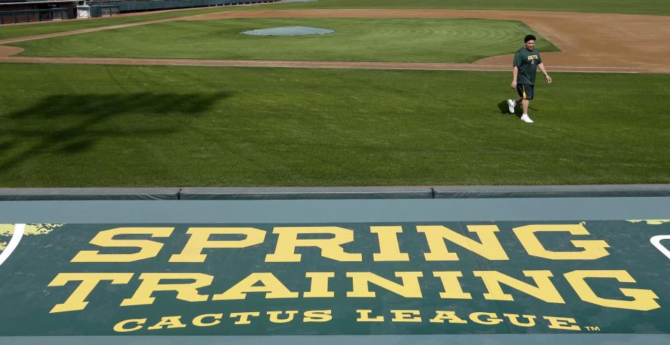 Oakland Athletics' Bartolo Colon walks back to the dugout after his physical Monday, Feb. 11, 2013, in Phoenix. The Athletics' pitchers and catchers start practice Tuesday. (AP Photo/Darron Cummings)