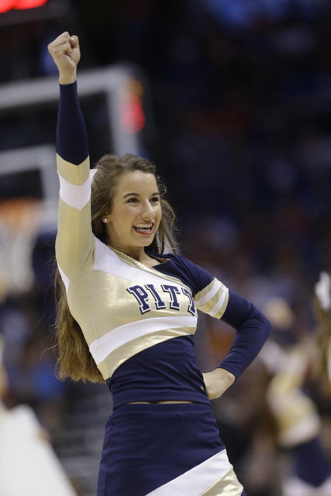 A Pittsburgh cheerleader performs during the first half in a third-round game in the NCAA college basketball tournament against Florida, Saturday, March 22, 2014, in Orlando, Fla. (AP Photo/John Raoux)