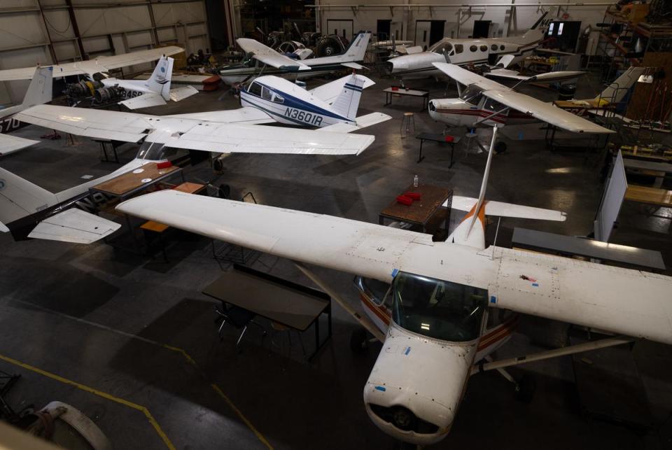 Grounded aircraft sit inside the Maintenance Hanger where students learn to fix mechanical issues at the Texas State Technical College in Waco on Oct. 24, 2022.