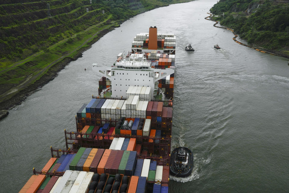 A cargo ship transits the Panama Canal in Panama City, Thursday, June 13, 2024. Panama Canal authorities said they will increase ship transit through the interoceanic waterway due to drought-related restrictions.  (AP Photo/Matias Delacroix)