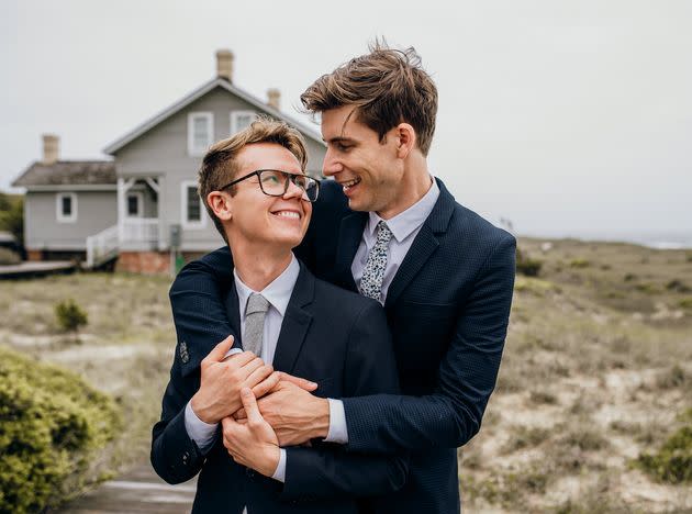 Luke, left, with his husband, Hans, on their wedding day (Photo: Courtesy of Bird and Rose Photography)