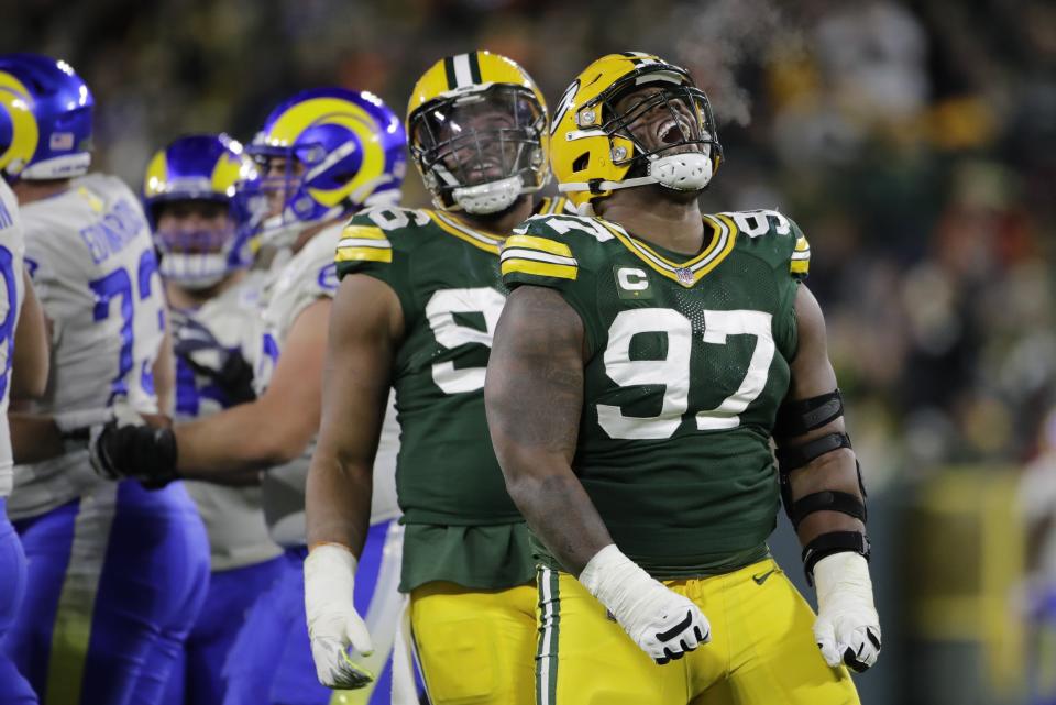 Green Bay Packers' Kenny Clark celebrates his sack during the second half of an NFL football game against the Los Angeles Rams Sunday, Nov. 28, 2021, in Green Bay, Wis. (AP Photo/Aaron Gash)