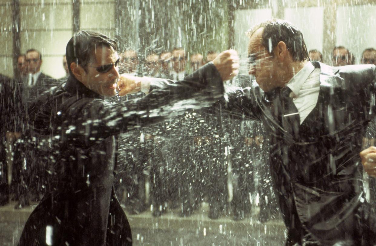 Neo (Keanu Reeves, left) battles the villainous Agent Smith (Hugo Weaving) in 2003's "The Matrix Revolutions."