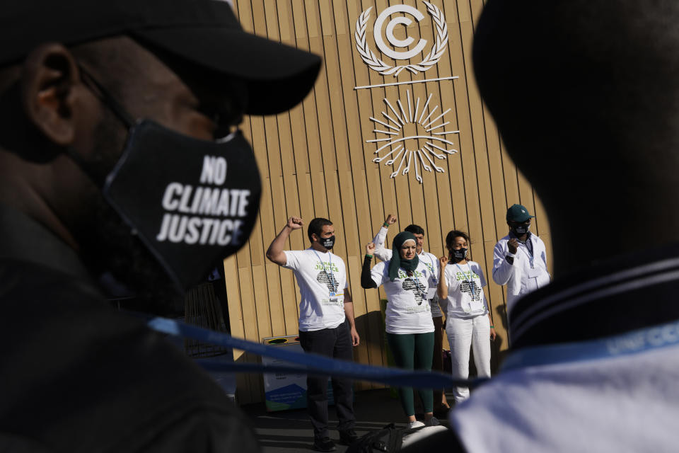 FILE - Demonstrators participate in a silent protest for climate justice and human rights at the COP27 U.N. Climate Summit, Nov. 10, 2022, in Sharm el-Sheikh, Egypt. (AP Photo/Peter Dejong, File)