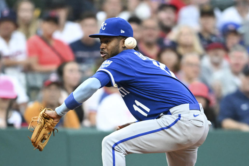 Kansas City Royals' Maikel Garcia misplays a fielder's choice hit into by Cleveland Guardians' Amed Rosario to score Bo Naylor during the fourth inning of a baseball game Saturday, July 8, 2023, in Cleveland. (AP Photo/Nick Cammett)