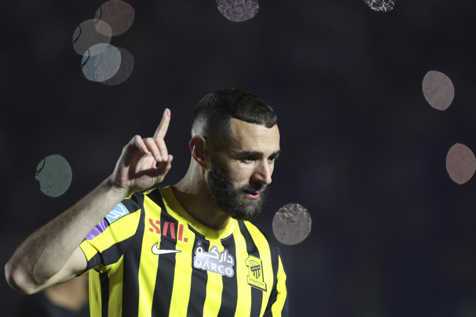 Saudi soccer team Al Ittihad player Karim Benzema greets Saudi fans during his presentation ceremony at King Abdullah Sports City Stadium in Jeddah, Saudi Arabia, Thursday, June 8, 2023. Benzema, who left Real Madrid after 14 years and 648 games, is set to play against his former Madrid teammate Cristiano Ronaldo, who joined Al-Nassr in January. (AP Photo)