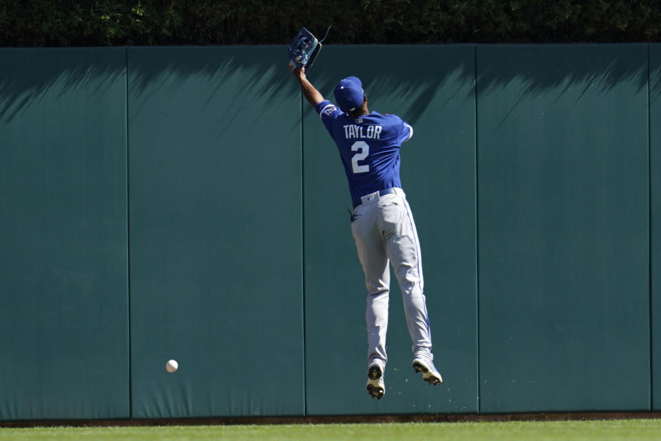 Kansas City Royals center fielder Michael A. Taylor (2) cannot reach a Detroit Tigers' Riley Greene triple in the first inning of a baseball game in Detroit, Saturday, July 2, 2022. (AP Photo/Paul Sancya)