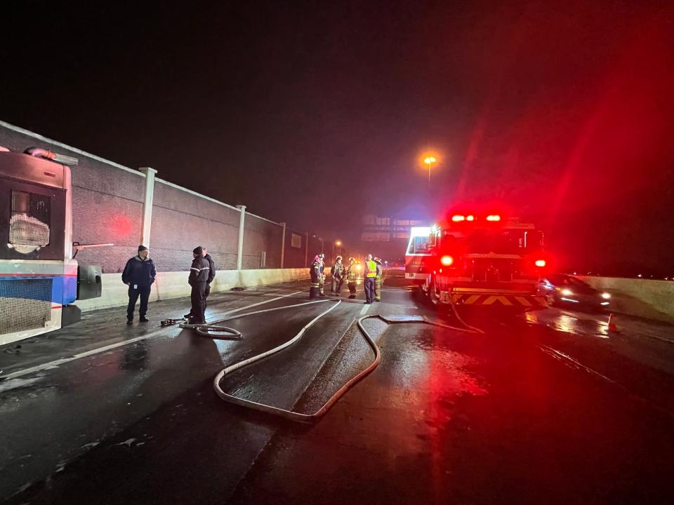 Canton firefighters wait Wednesday night for a tow truck to arrive to remove a Stark Area Regional Transit Authority bus that caught fire along Interstate 77, south of Tuscarawas Street W in Canton.