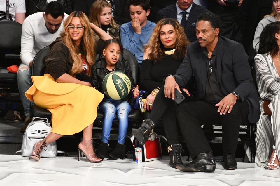 Beyonce, Blue Ivy Carter, Tina Knowles and Richard Lawson sit courtside at an NBA all-star game.