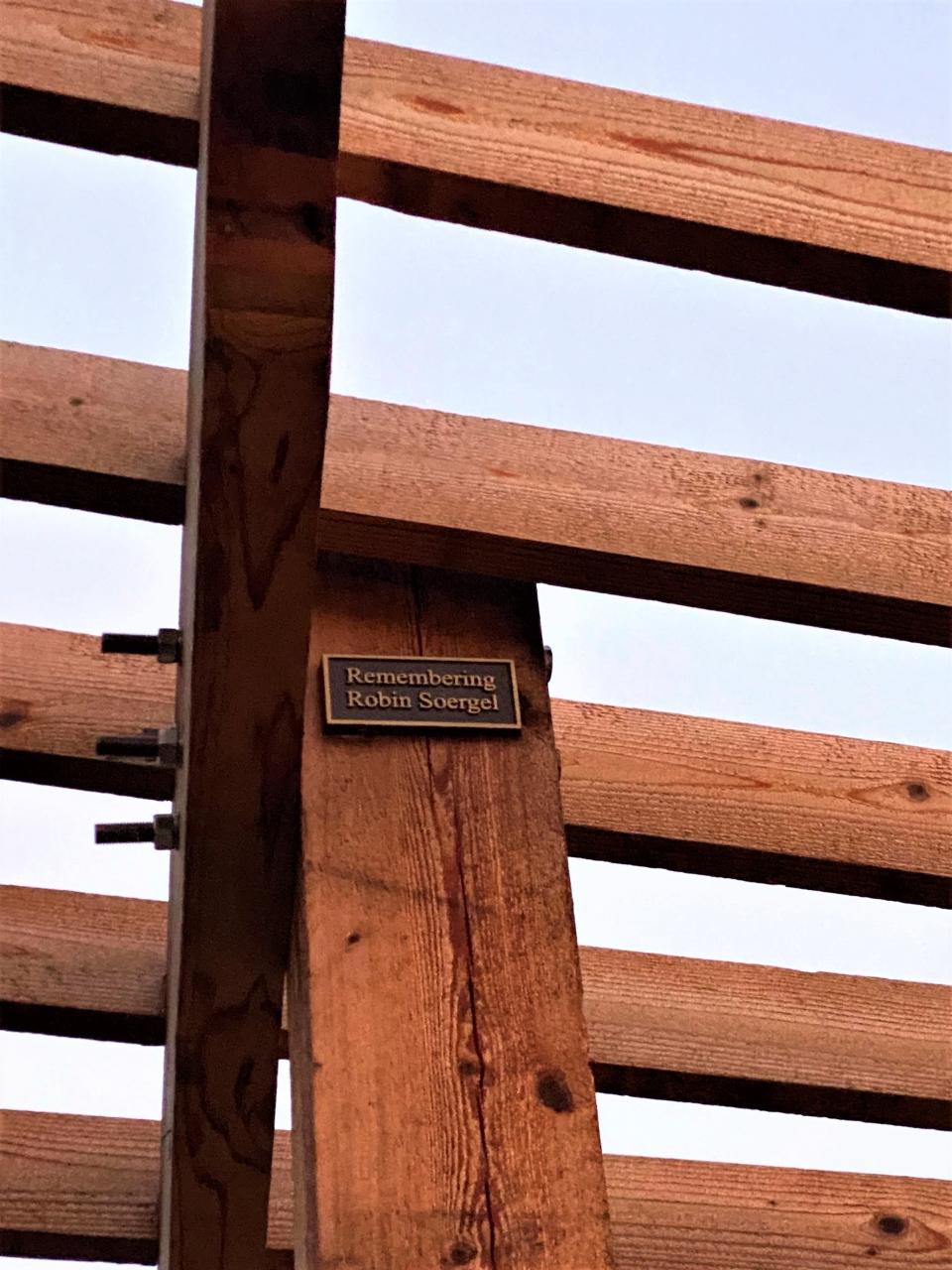 Each leg of the pergola honors various members of the community, like this one placed in memory of Robin Soergel, the late wife of Times-Union writer Matt Soergel.