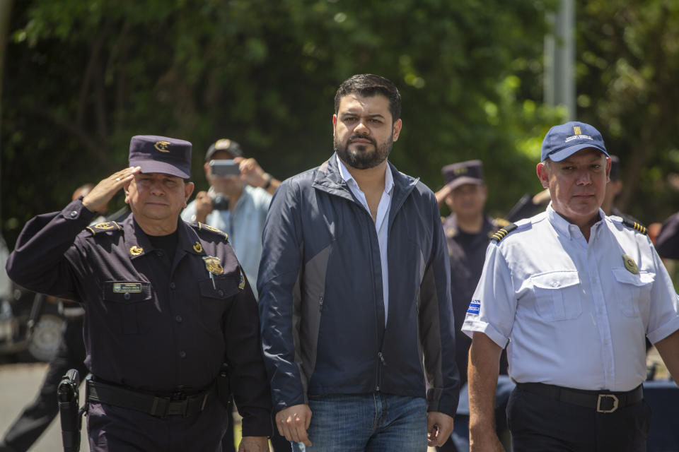 El Salvador's Justice and Public Security Minister Rogelio Rivas, center, accompanied by National Police Director Mauricio Arriaza, left, and migration agency Director Ricardo Cucalon arrive to launch a new border patrol on the border with Guatemala in La Hachadura, El Salvador, Thursday, Sept. 12, 2019. The deployment of a new border patrol is part of an agreement between the Salvadoran government and acting U.S. Homeland Security Secretary Kevin McAleenan to slow the flow of migrants trying to reach the United States. (AP Photo/Moises Castillo)