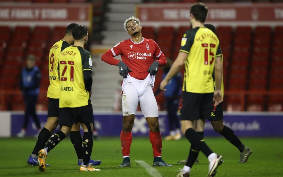 Nottingham Forest's Lyle Taylor (centre) appears dejected after a missed chance during the Sky Bet Championship match at the City Ground, Nottingham - Watford miss out on Championship top spot with goalless draw at Nottingham Forest - PA