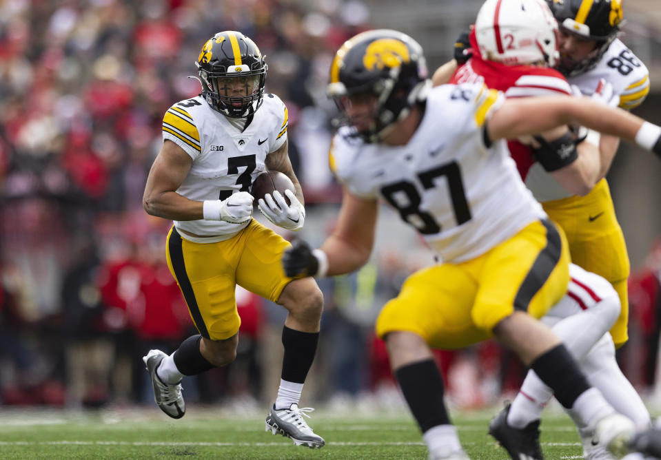 Iowa's Kaleb Brown (3) carries the ball against Nebraska during the first half of an NCAA college football game, Friday, Nov. 24, 2023, in Lincoln, Neb. (AP Photo/Rebecca S. Gratz)