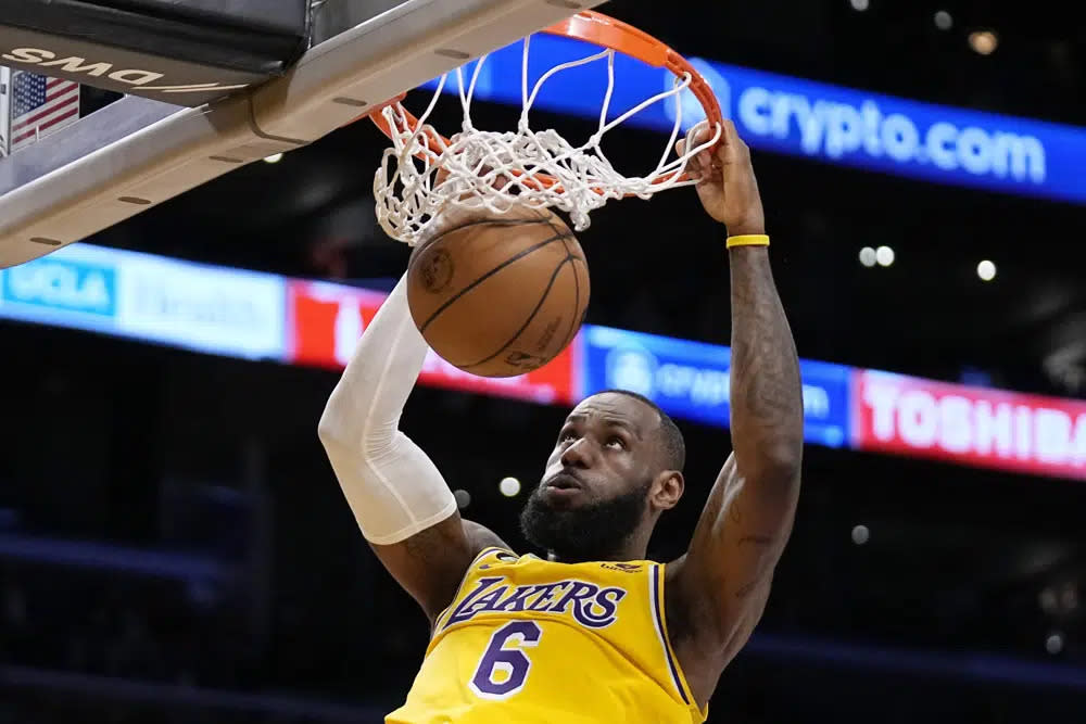 Los Angeles Lakers forward LeBron James dunks during the first half of an NBA basketball game against the San Antonio Spurs, Jan. 25, 2023, in Los Angeles. (AP Photo/Mark J. Terrill, File)