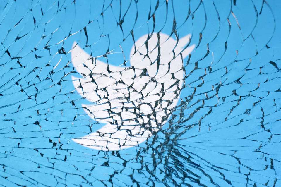 Twitter logo is seen through broken glass in this illustration taken, January 25, 2023. REUTERS/Dado Ruvic/Illustration