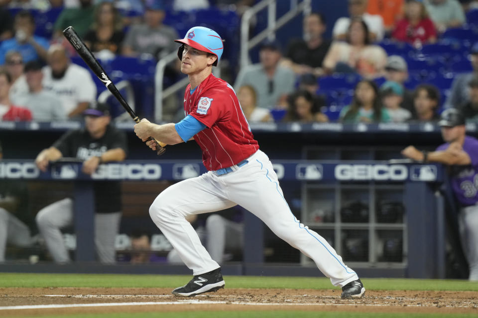 Miami Marlins' Joey Wendle singles to left field during the second inning of a baseball game against the Colorado Rockies, Saturday, July 22, 2023, in Miami. (AP Photo/Marta Lavandier)