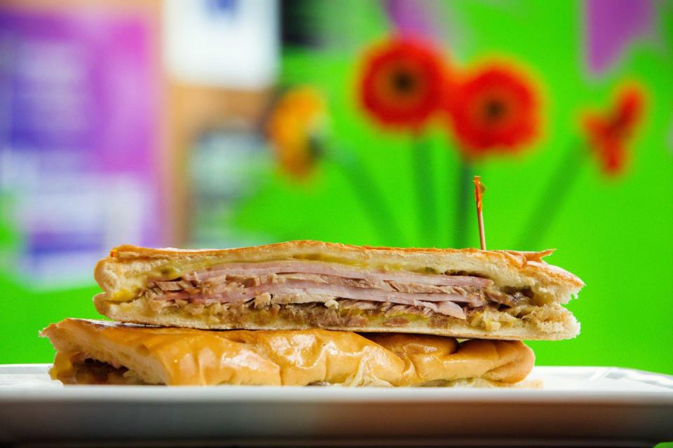 <p><strong>Cubano</strong></p><p>South Floridans know a good Cubano when they see one. Made with two kinds of pork, Swiss cheese, mustard and pickles pressed on Cuban bread. While you can find this sandwich everywhere, <a href="https://www.versaillesrestaurant.com/" rel="nofollow noopener" target="_blank" data-ylk="slk:Versailles;elm:context_link;itc:0;sec:content-canvas" class="link ">Versailles</a> in Miami’s Little Havana offers one that's not to be missed.</p>