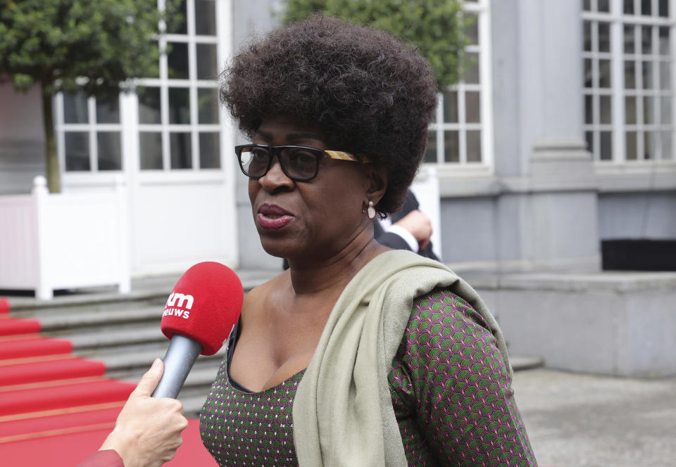 Juliana Lumumba, the daughter of Patrice Lumumba, speaks with the media as she arrives for a ceremony at the Egmont Palace in Brussels, Monday, June 20, 2022. On Monday, more than sixty one years after his death, the mortal remains of Congo's first democratically elected prime minister Patrice Lumumba will be handed over to his children during an official ceremony in Belgium. (AP Photo/Olivier Matthys, Pool)