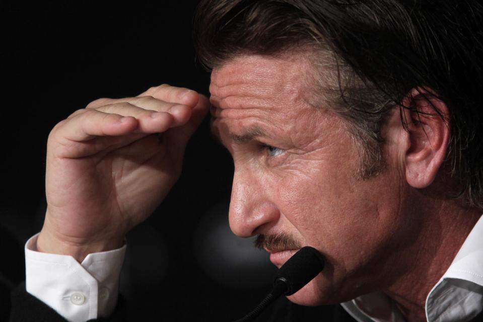 Actor Sean Penn gestures during a press conference for the Haiti Carnival charity event at the 65th international film festival, in Cannes, southern France, Friday, May 18, 2012. (AP Photo/Francois Mori)