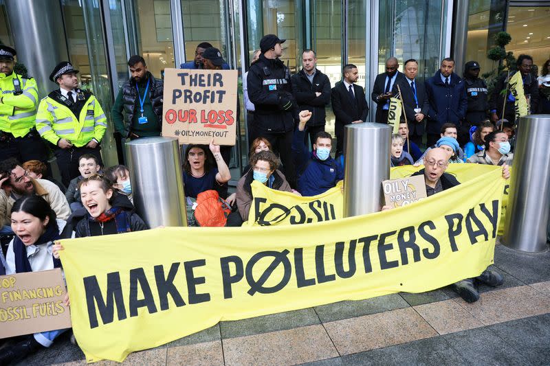 FILE PHOTO: 'Oily Money Out' protest against fossil fuel companies outside Barclays Bank in London