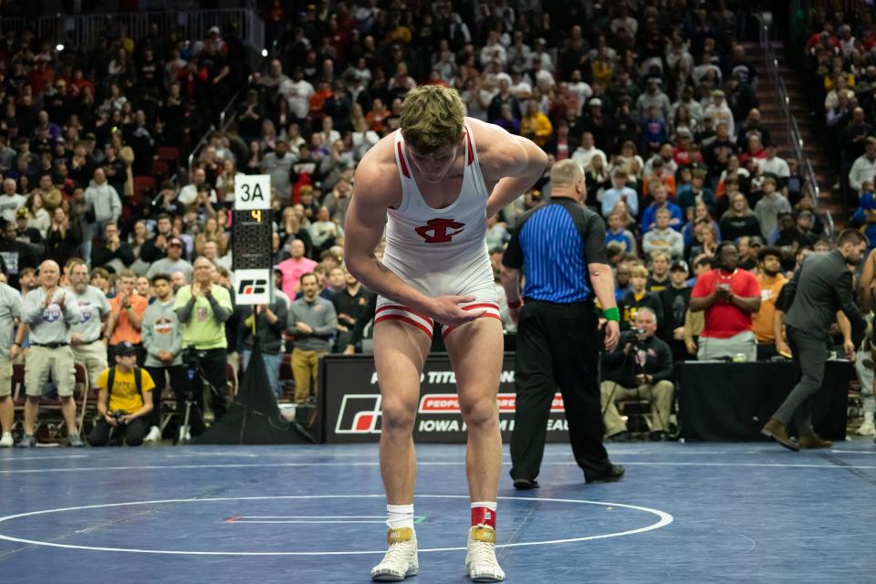 Ben Kueter of Iowa City High wins the Class 3A 220-pound state wrestling championship on Feb. 18 at Wells Fargo Arena in Des Moines.