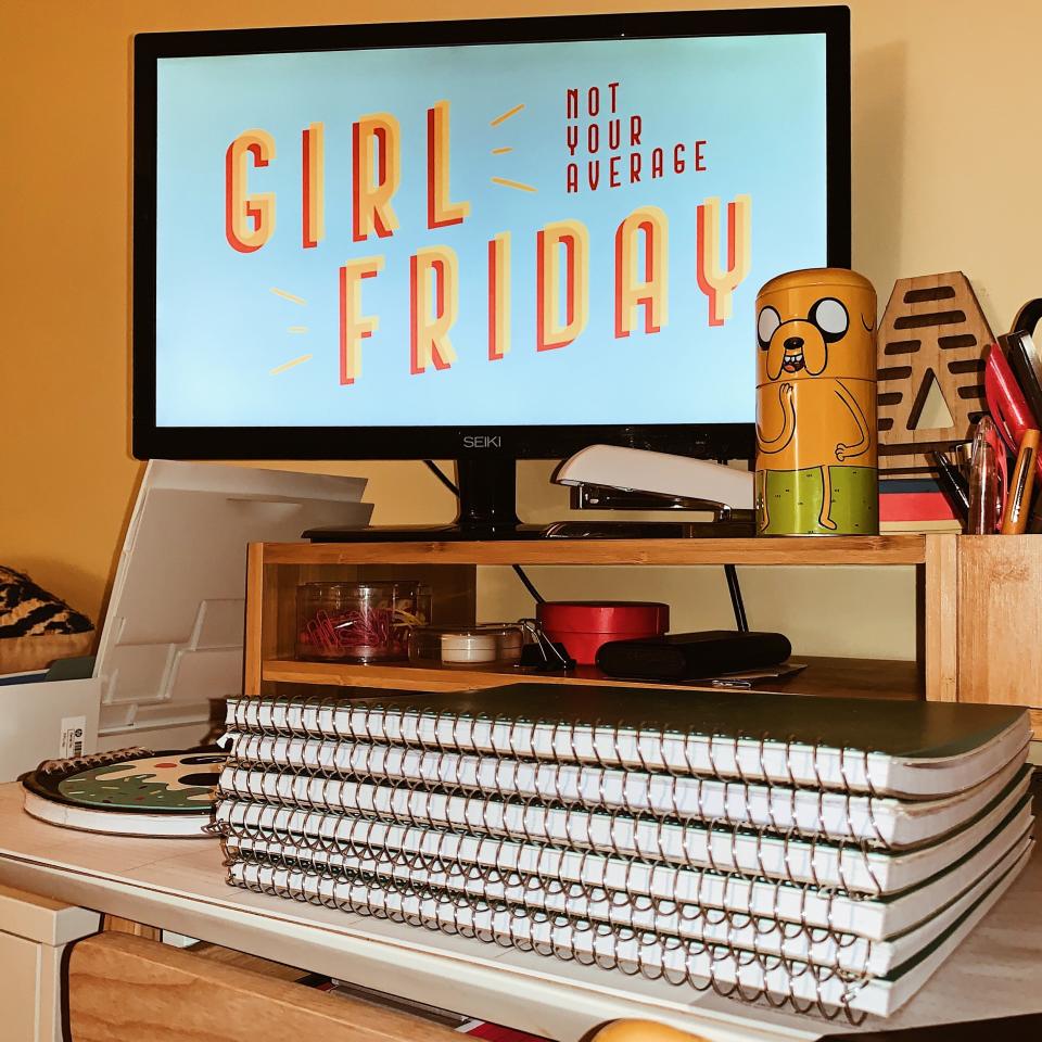 Young keeps a paper notebook at her desk for each client. (Photo: Luke Vaughan)