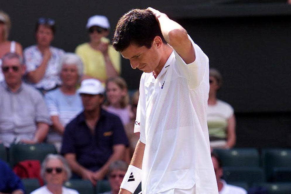 Dejected: Henman reacts as the 2001 Wimbledon semi slips away: Getty Images