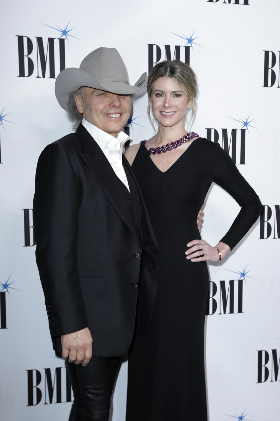 FILE - This Nov. 12, 2019 file photo shows Dwight Yoakam, left, and Emily Joyce at 67th Annual BMI Country Awards ceremony in Nashville, Tenn. The couple were married in March just prior to the quarantine in a private ceremony at St Monica Catholic Church in Santa Monica, Calif. (Photo by Al Wagner/Invision/AP, FIle)