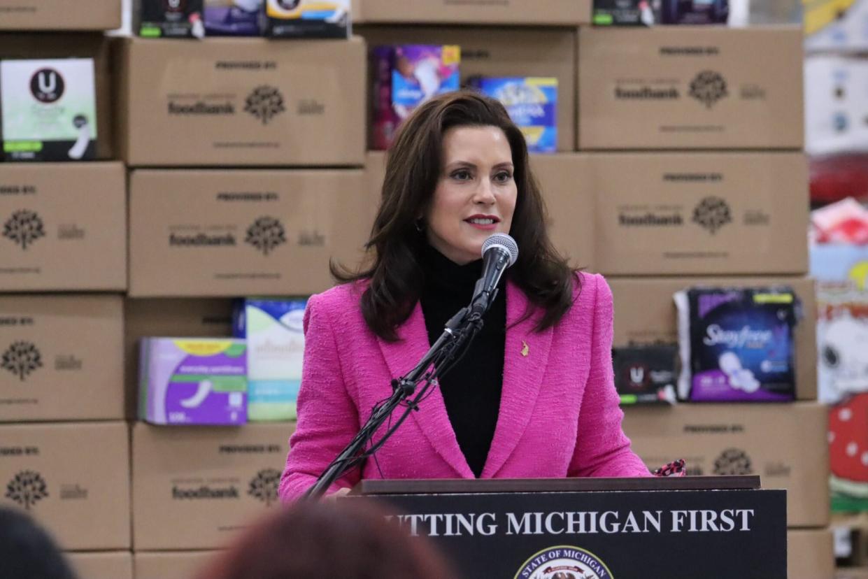 Michigan Gov. Gretchen Whitmer signing the "tampon tax" repeal