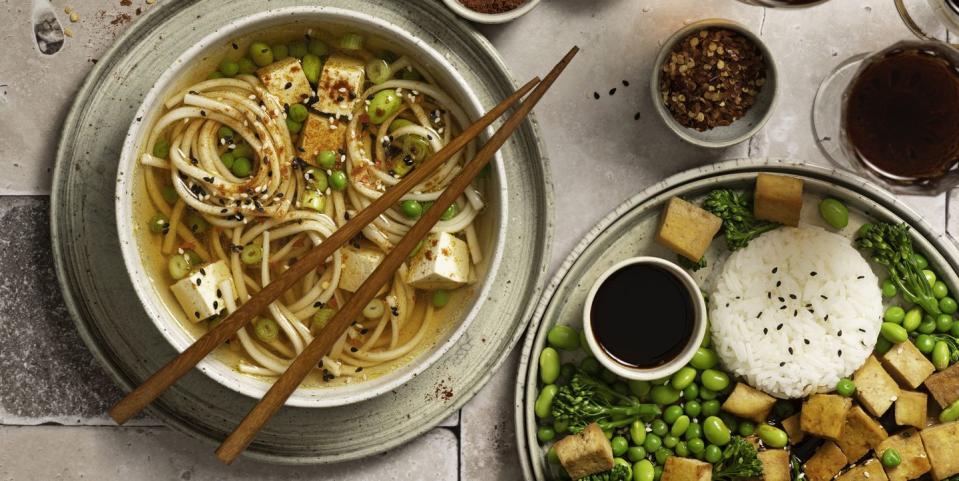 vegan plates of ramen and tofu with rice and edamame