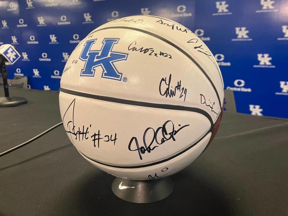 UK players and coaches have all signed basketballs that will be sold to raise funds for eastern Kentucky flood relief.