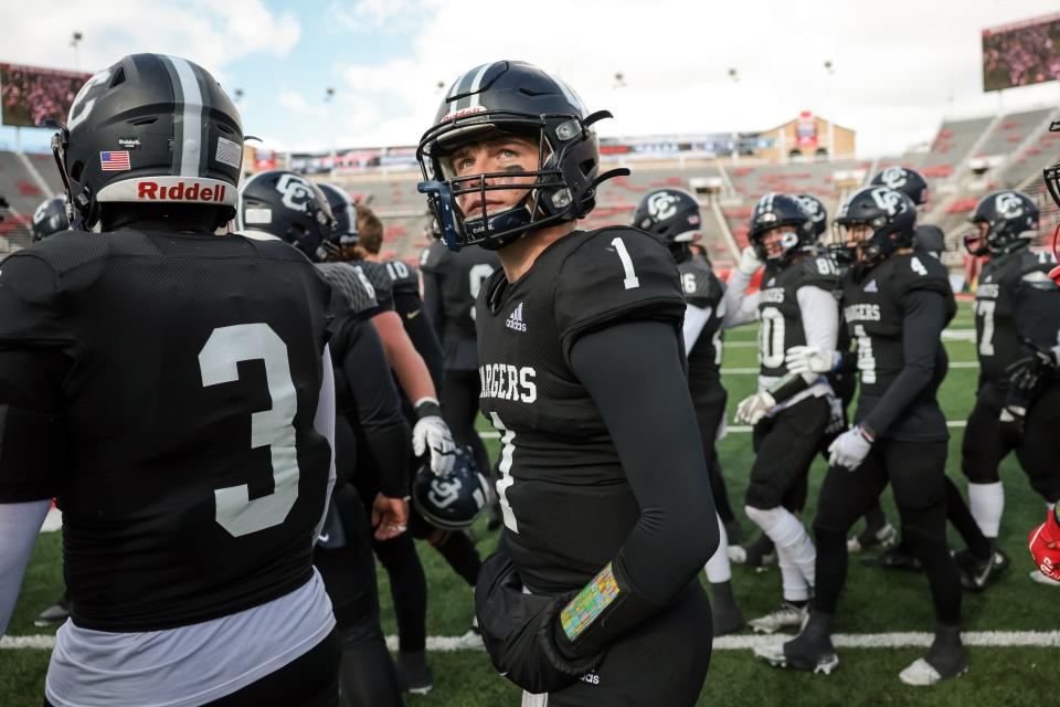 Corner Canyon QB Isaac Wilson looks up at the scoreboard during his team’s win over Farmington in a 6A football semifinal.