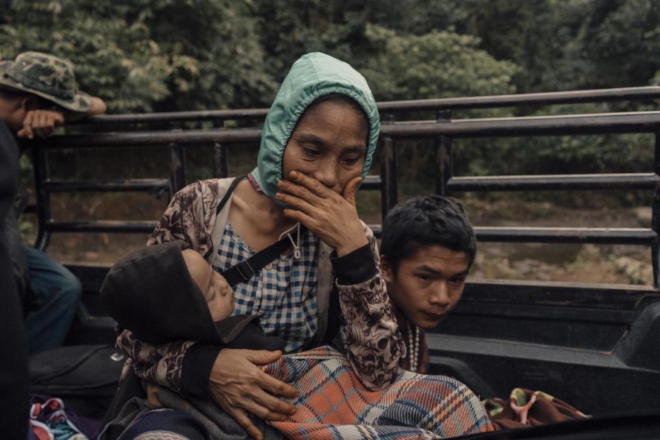 Naw Chi Paw and her son grieve after his father was killed by a Burma Army airstrike on Lay Wah village in January. They were on their way to a clinic to be treated for shrapnel injuries.