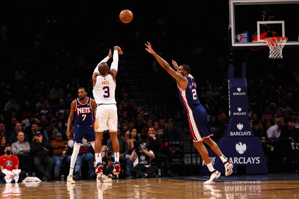 Phoenix Suns guard Chris Paul (3) shoots against Brooklyn Nets forward LaMarcus Aldridge (21) during the first half of an NBA basketball game, Saturday, Nov. 27, 2021, in New York. (AP Photo/Jessie Alcheh)