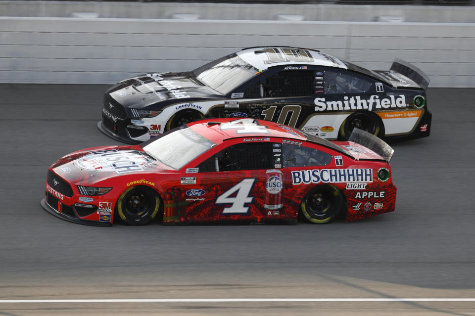 Kevin Harvick (4) races Aric Almirola (10) during the NASCAR Cup Series auto race at Michigan International Speedway in Brooklyn, Mich., Sunday, Aug. 9, 2020. (AP Photo/Paul Sancya)