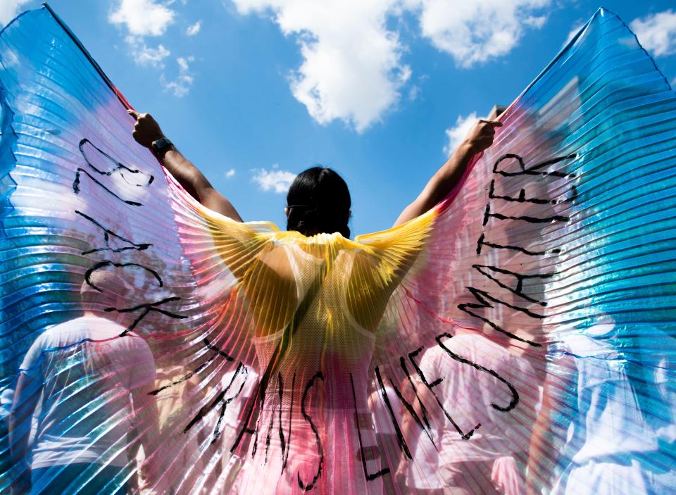 A protester displays wings while marching on on June 14, 2020 in the Brooklyn borough of New York City. 