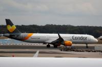 An airplane with the logo of air carrier Condor by Thomas Cook is seen at the airport in Frankfurt