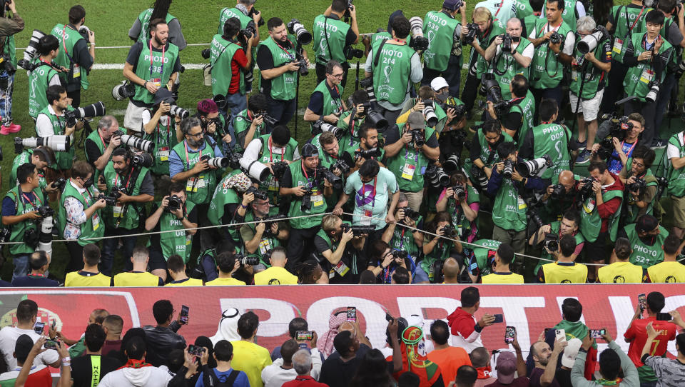 Press members taking photos of Ronaldo at the FIFA World Cup.