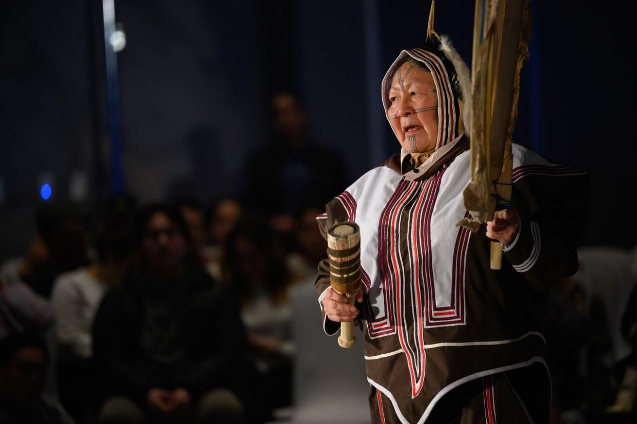 Drum dance singer Julia Ogina performs at a public event follwing the signing of the Nunavut devolution agreement. Organizers say they featured all Inuit performers and artists at the event. (The Canadian Press - image credit)