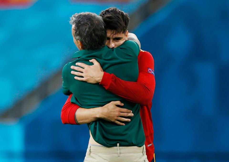 Alvaro Morata hugs manager Luis Enrique after scoring (Reuters)