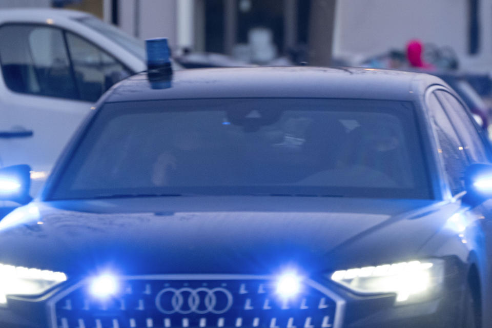 Masked and armed Dutch police in an armored car transport some of the suspects to the high security court building where the trial opened in Amsterdam, Netherlands, Tuesday, Jan. 23, 2024, for suspects in the slaying of campaigning Dutch journalist Peter R. De Vries. A long-delayed trial opened Tuesday of nine men accused of involvement in the fatal shooting on a downtown Amsterdam street of Dutch investigative reporter de Vries. (AP Photo/Peter Dejong)