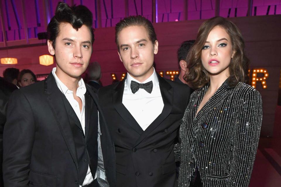 <p>Kevin Mazur/VF19/WireImage</p> Cole Sprouse, Dylan Sprouse, and Barbara Palvin attend the 2019 Vanity Fair Oscar Party