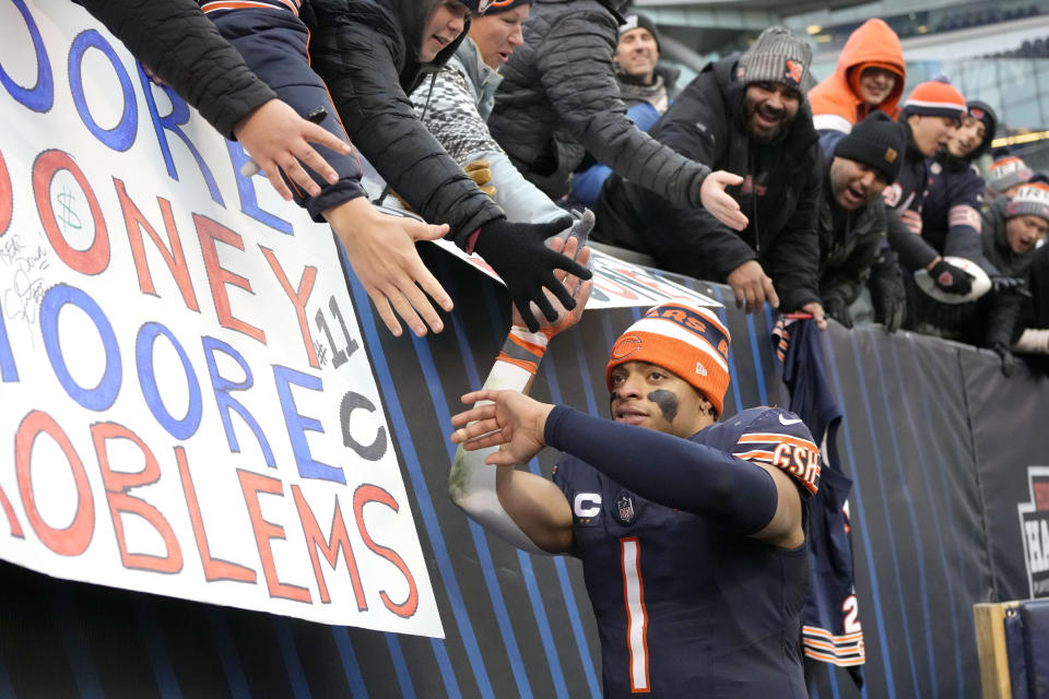 Chicago Bears quarterback Justin Fields celebrates with fans after the team's 28-13 win over the Detroit Lions in an NFL football game Sunday, Dec. 10, 2023, in Chicago. (AP Photo/Nam Y. Huh)