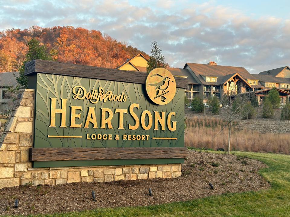 Dollywood HeartSong lodge sign in front of Smoky Mountains