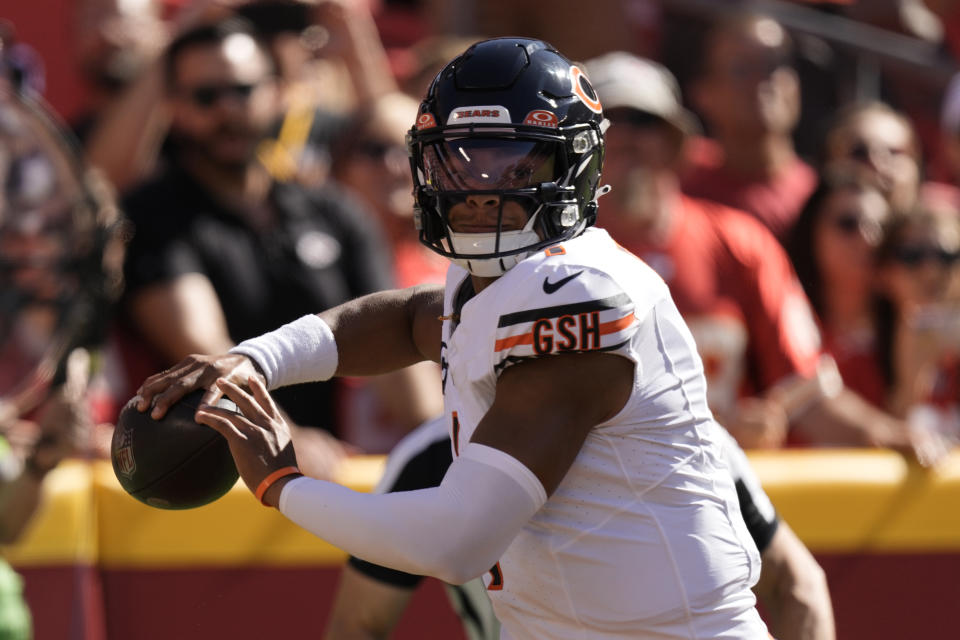 Chicago Bears quarterback Justin Fields throws during the first half of an NFL football game against the Kansas City Chiefs Sunday, Sept. 24, 2023, in Kansas City, Mo. (AP Photo/Charlie Riedel)